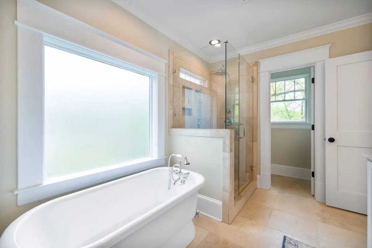 A clean, bright bathroom, the usual place a moisture check starts. Albany.
