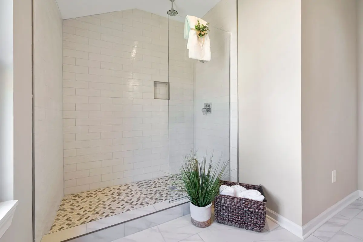 A clean, bright bathroom, the usual place a moisture check starts. Albany.